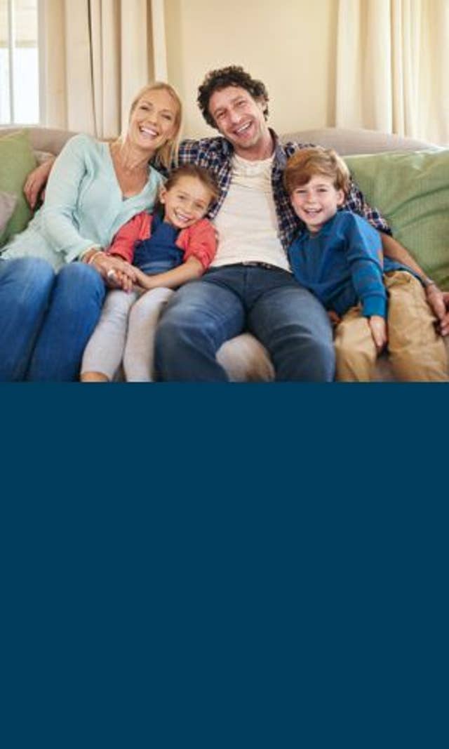 Family sitting on a couch